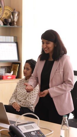 A woman presenting to the client