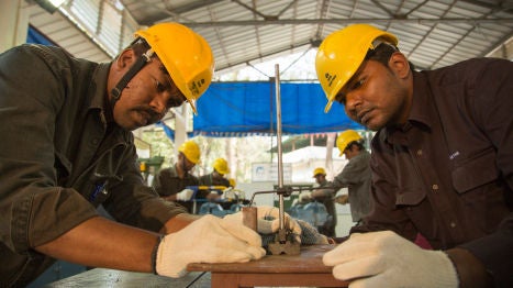 Two men working on Tata Power construction site